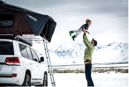Overland famliy camping in the winter