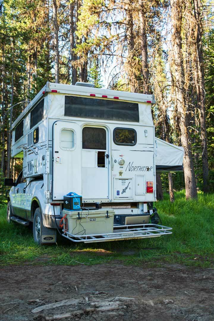 ultimate camping rv setup in the woods